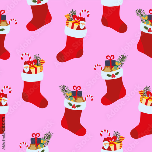 Christmas stockings seamless pattern with gifts and candy canes on pink background