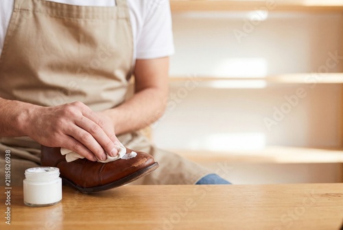 Applying Protective Cream to Leather Footwear Surface in Professional Workshop