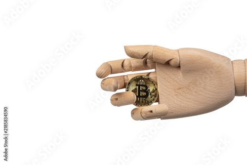 Wooden mannequin hand holding a Bitcoin coin isolated on white background. Cryptocurrency, digital finance, blockchain and investment concept with copy space.