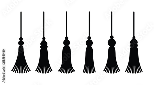 A collection of decorative fabric tassel silhouettes in black and white