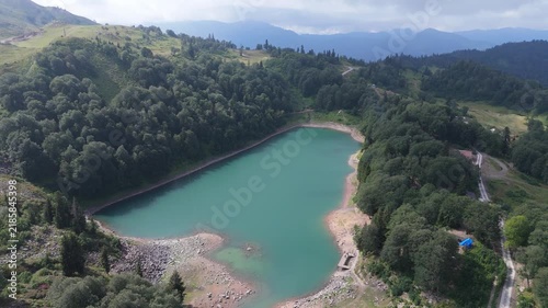 Aerial view Green lake, Goderdzi, Georgia. Green Lake on Goderdzi Pass, Adjara, Georgia (Mtsvane Lake).  Green Lake fills aerial view beside dense forest in Adjara, Georgia. Nature documentaries and t