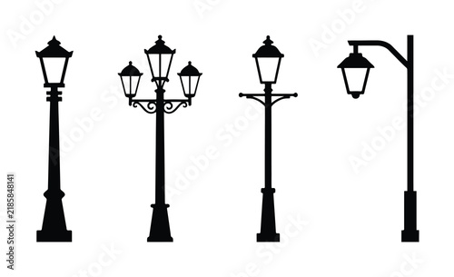 Set of four vintage street lamp silhouettes isolated on white background