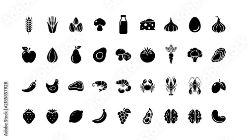 Assorted food icons in a grid on a white surface during a studio shoot