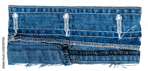 Piece of torn denim on a white background. Denim texture
