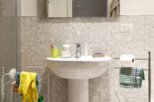 Bathroom renovation work with ceramic mosaic tiles wall background.
