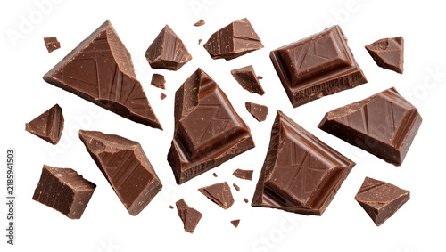 Fotografie Dark chocolate chunks scattered, isolated on transparent background