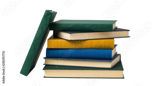 Bild auf Leinwand Stack of colorful hardcover books leaning against a single green book, isolated