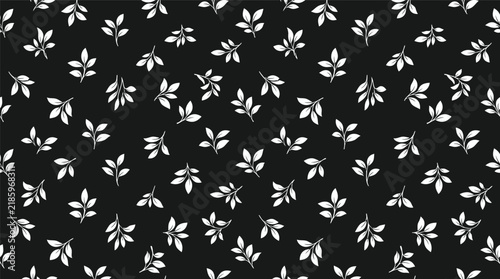 Black and white botanical leaf pattern on seamless textile background, repeating floral motif suitable for fabric and decor design.