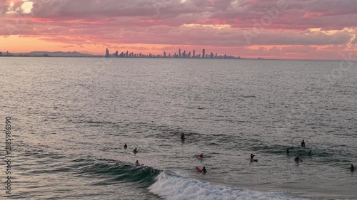 Surfers in the lineup at Snapper Rocks at sunset, aerial drone footage, Coolangatta, Gold Coast, Queensland Australia