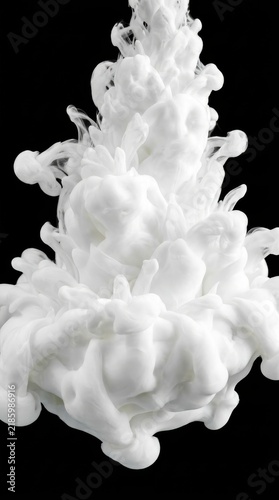 White acrylic paint swirling in water against a black background