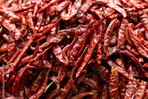 Pile of dried red hot and spicy chili pepper prepared for sale on the supermarket in Thailand,