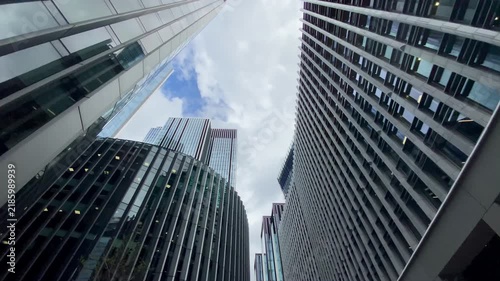 Walk through glass steel skyscrapers soaring into sky City London