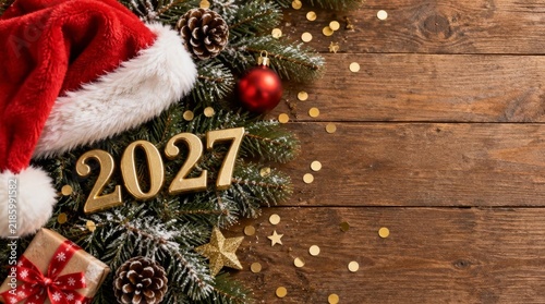An elegant New Year 2027 greeting card design featuring bold, glossy golden number 