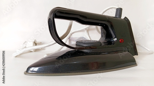 Принти на полотні Vintage black electric iron with white braided cord and temperature dial