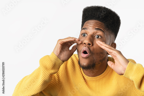 Fotografie Young handsome man shouting and calling isolated over white background, expressi