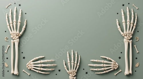 Skeleton hands bones border on green background for Halloween party invitation flat lay banner empty copy space decor item