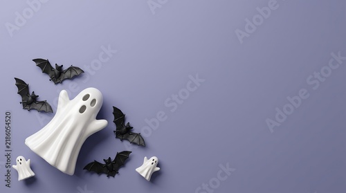 Minimalist Halloween ghost and bats on purple background. Spooky holiday flat lay with white ghosts and black bats. Festive seasonal banner with copy space.