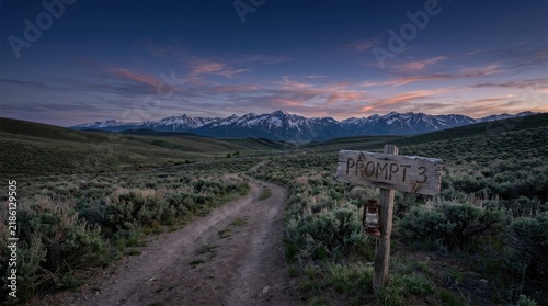 Dramatic mountain landscape at dusk with colorful sky and winding road