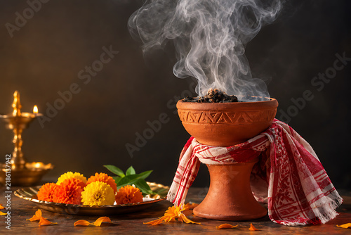 Durga Puja Dhunuchi Ritual with Marigold Flowers and Incense Smoke