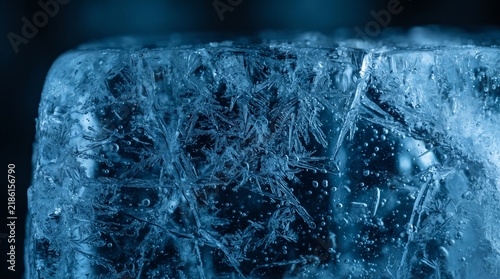 Frozen Blue Ice Cube Macro - Crystalline Texture with Air Bubbles - Cold Winter Abstract Background