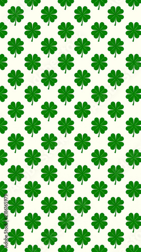 Seamless pattern of green four-leaf clovers symbolizing luck and St. Patrick’s Day celebration.