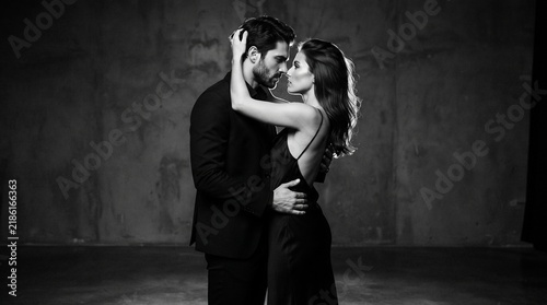 Elegant Couple in Formal Evening Attire - Romantic Luxury Interior with Fireplace - Opulent Mansion Gala Party Scene