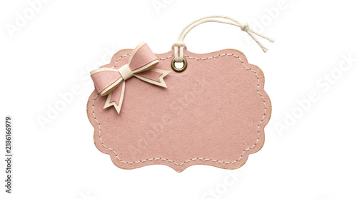 Pink paper gift tag with a bow isolated on transparent background