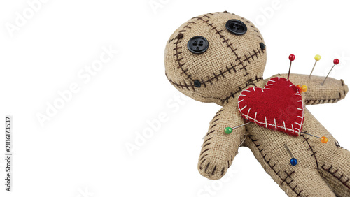 Fotografie Creepy voodoo doll toy with pins in its red heart isolated on transparent backgr