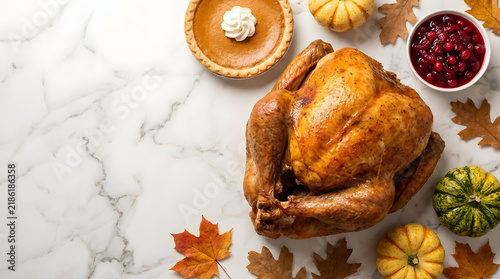 Thanksgiving turkey dinner with pumpkin pie on marble