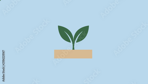 Young green plant sprout growing from a soil block representing growth, ecology, and nature conservation.