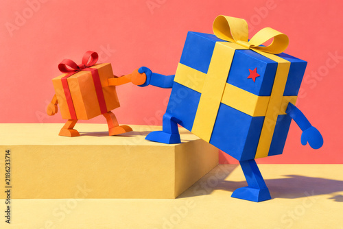 Large gift helping smaller present ascend platform