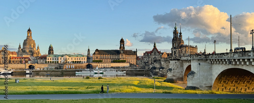Landscape of historical buildings along the river at sunset in Dresden, Germany 