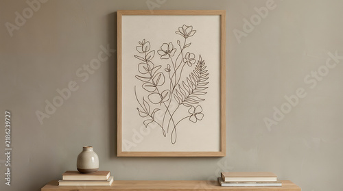 Minimalist floral line art in wood frame for contemporary home interior decor.
