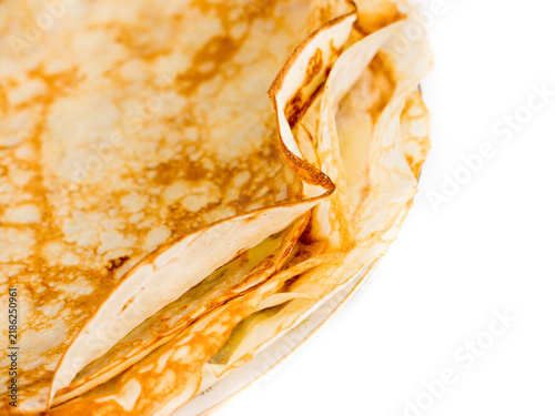 Pancakes lying on a plate.