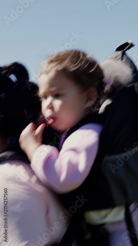Multiethnic family with a toddler hiking in the mountains