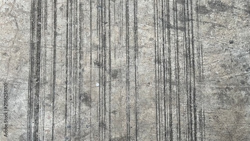 Vertical Grooved Concrete Texture with Black Tire Marks