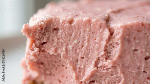 Close-up of creamy pink strawberry mousse dessert with texture