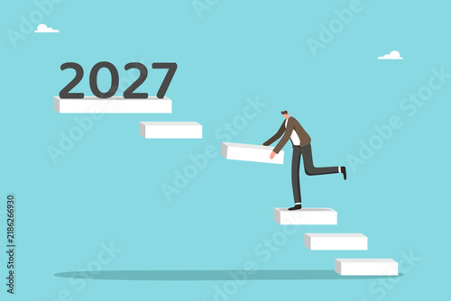 Strategic planning for achieving success in new year, setting ambitious business goals, developing new strategies, creative approach to future projects, man placing missing step toward 2027.