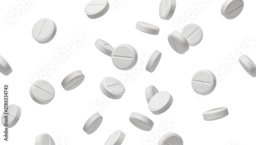 Konstfotografi Scattered white round pills with a dividing line, isolated on transparent backgr