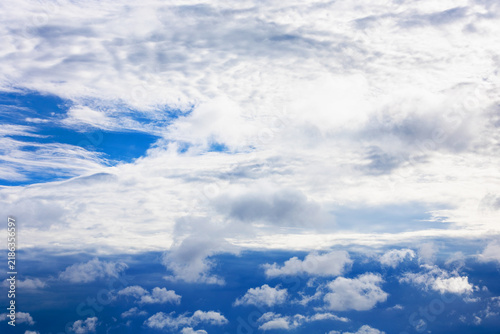 Naklejka large cloud closes sun in dark blue storm sky