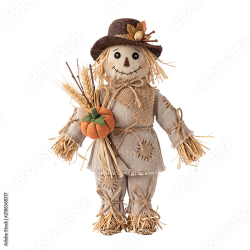 Rustic straw scarecrow doll holding a pumpkin bouquet, wearing a stitched hat and burlap outfit, whimsical autumn harvest Halloween decor