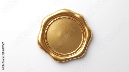 A gold wax seal stamp on a white background, used for official documents and letters.