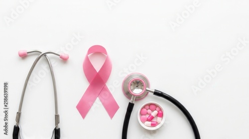 Pink Ribbon And Stethoscope Representing Breast Cancer Awareness And Medical Care