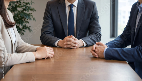 Business colleagues discussing project at desk in modern office with business meeting corporate office meeting table business professionals office environment business people meeting room