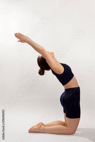 Woman Performing Camel Yoga Pose in Studio