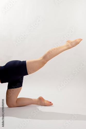 Pilates Leg Extension Exercise on White Background