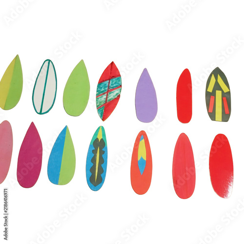 Assorted colorful paper surfboard shapes arranged in two rows on a plain , for a summer, themed craft project display isolated on a transparent background