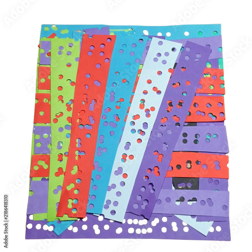 Colorful paper strips with punched circular holes layered in a vertical arrangement on a solid , for projects isolated on a transparent background