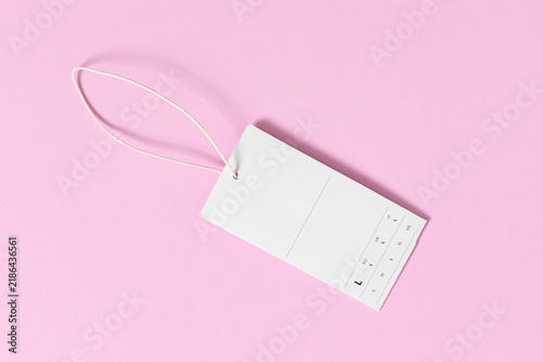 blank white clothing price tag mock up on pink background