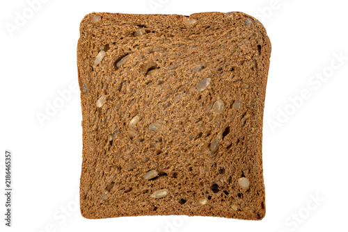 Fototapeta Whole grain bread slice texture with embedded sunflower pumpkin seeds